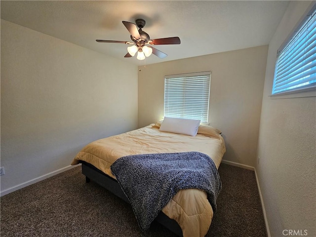 bedroom featuring carpet flooring, baseboards, and ceiling fan
