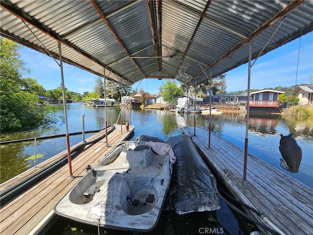dock with a water view and a residential view