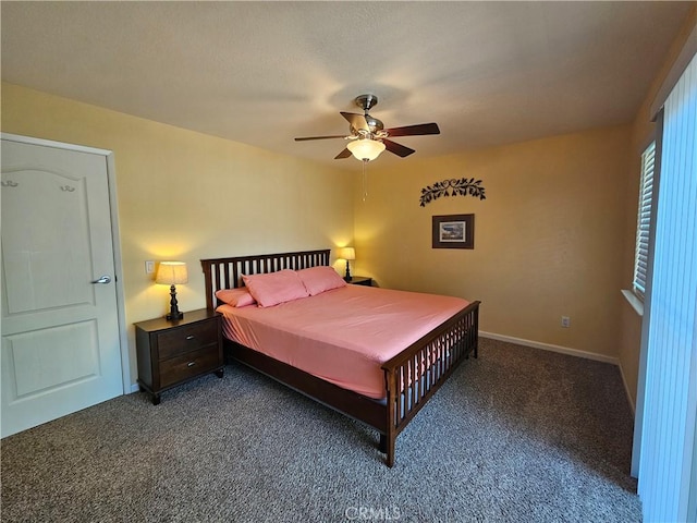 carpeted bedroom featuring ceiling fan and baseboards