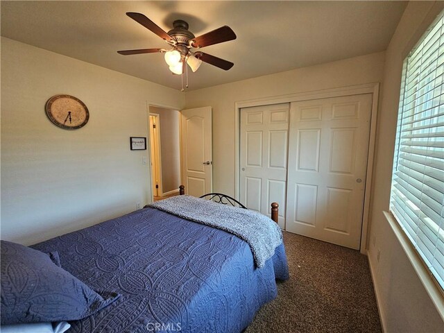 bedroom with carpet, ceiling fan, and a closet