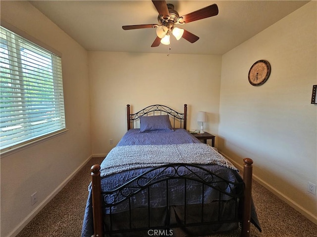 bedroom with carpet floors, baseboards, and ceiling fan