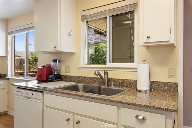 12855 Island Cir, Clearlake Oaks, CA 95423 - kitchen with dishwasher and white cabinetry