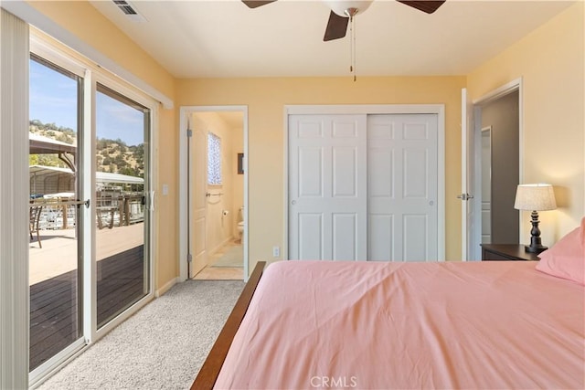 12855 Island Cir, Clearlake Oaks, CA 95423 - bedroom with access to exterior, carpet, ensuite bathroom, a ceiling fan, and a closet