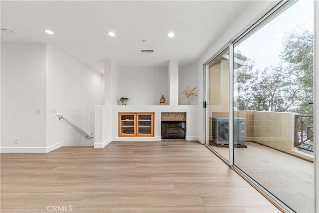 28456 Sassetta Way, Lake Forest, CA 92679 - unfurnished living room with light wood-type flooring, recessed lighting, a fireplace, and baseboards