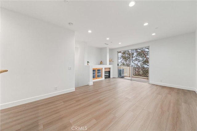 28456 Sassetta Way, Lake Forest, CA 92679 - unfurnished living room with light wood finished floors, recessed lighting, and baseboards