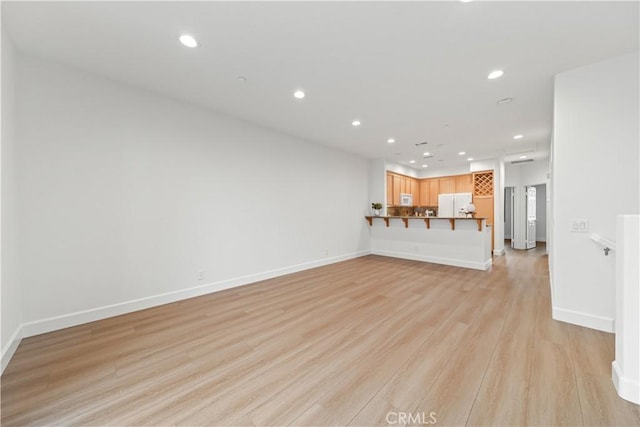 28456 Sassetta Way, Lake Forest, CA 92679 - unfurnished living room featuring recessed lighting, light wood-style floors, and baseboards