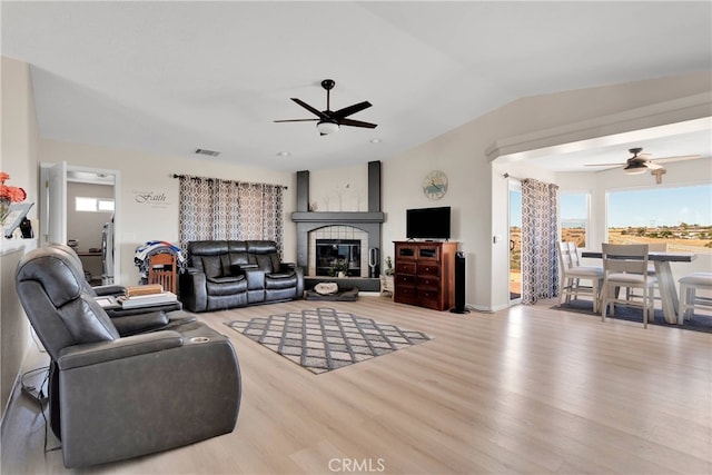 7138 Amanda Way, Hesperia, CA 92345 - living area with a ceiling fan, wood finished floors, a fireplace, and vaulted ceiling