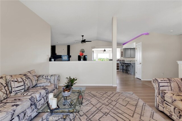 7138 Amanda Way, Hesperia, CA 92345 - living room with a ceiling fan, wood finished floors, vaulted ceiling, and baseboards