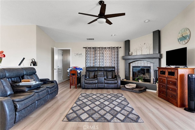 7138 Amanda Way, Hesperia, CA 92345 - living room featuring ceiling fan, wood finished floors, and a fireplace