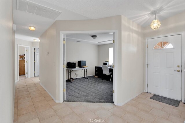 7138 Amanda Way, Hesperia, CA 92345 - foyer entrance with baseboards, light tile patterned floors, and light colored carpet