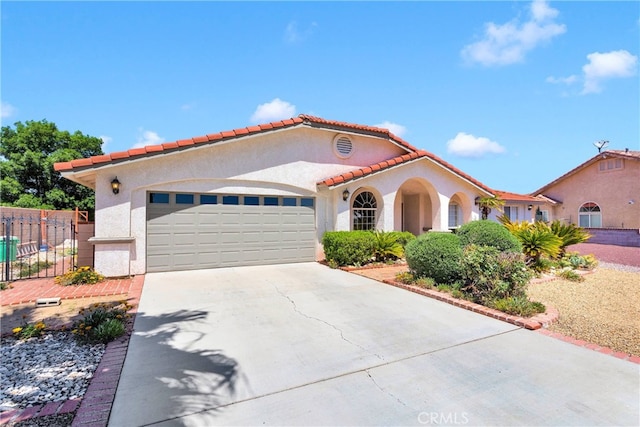 7138 Amanda Way, Hesperia, CA 92345 - mediterranean / spanish home featuring stucco siding, a garage, concrete driveway, and a tile roof