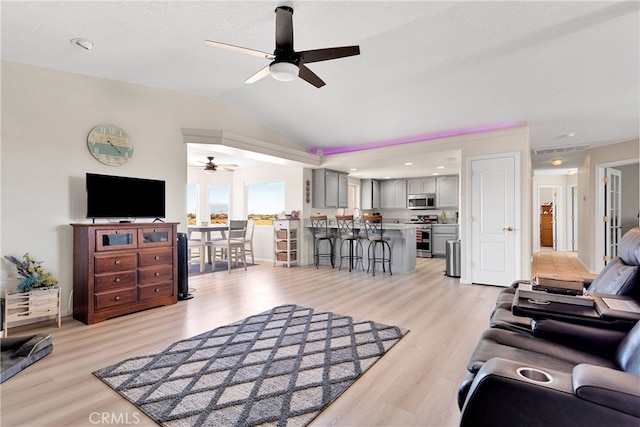 7138 Amanda Way, Hesperia, CA 92345 - living area with a ceiling fan, lofted ceiling, and light wood-type flooring