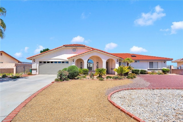 7138 Amanda Way, Hesperia, CA 92345 - mediterranean / spanish home featuring stucco siding, an attached garage, driveway, and a tiled roof