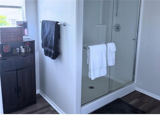 31832 Gimbal Way, Winchester, CA 92596 - bathroom with wood finished floors, a shower stall, and baseboards