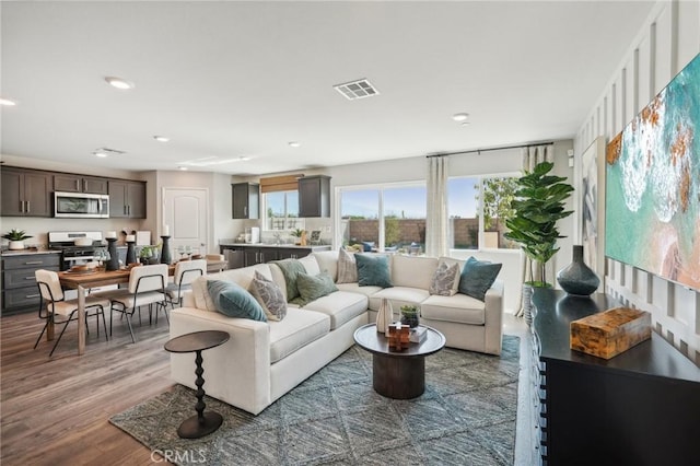 14063 Starlene St, Moreno Valley, CA 92555 - living room featuring wood finished floors and recessed lighting