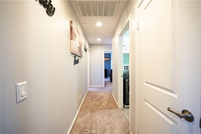 1357 Bannock St, Beaumont, CA 92223 - hallway with light colored carpet, baseboards, recessed lighting, and washer / clothes dryer