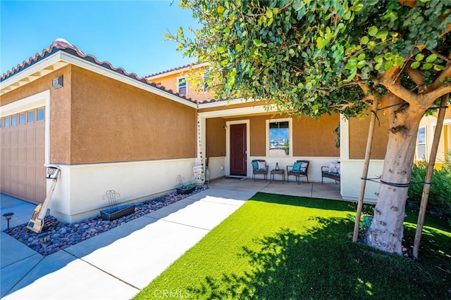 1357 Bannock St, Beaumont, CA 92223 - property entrance featuring stucco siding and a lawn