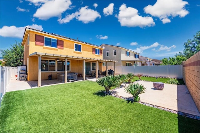 1357 Bannock St, Beaumont, CA 92223 - back of property featuring a hot tub, a patio area, and stucco siding