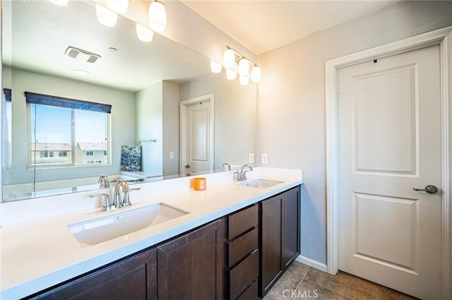 1357 Bannock St, Beaumont, CA 92223 - full bath with tile patterned flooring, double vanity, and baseboards