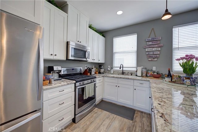 594 Rockaway Ave Unit B, Grover Beach, CA 93433 - kitchen featuring stainless steel appliances, a sink, healthy amount of natural light, light wood-style flooring, and recessed lighting