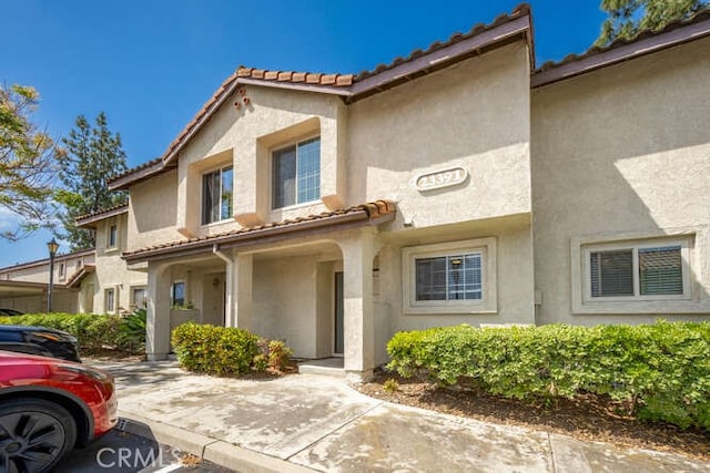 23391 La Crescenta Unit 270C, Mission Viejo, CA 92691 - mediterranean / spanish-style house featuring stucco siding and a tile roof