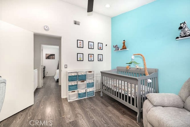 23391 La Crescenta Unit 270C, Mission Viejo, CA 92691 - bedroom with wood finished floors, a high ceiling, ceiling fan, and a crib