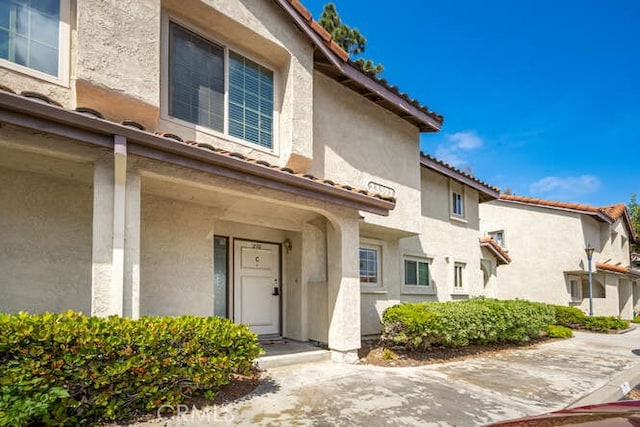 23391 La Crescenta Unit 270C, Mission Viejo, CA 92691 - doorway to property with stucco siding