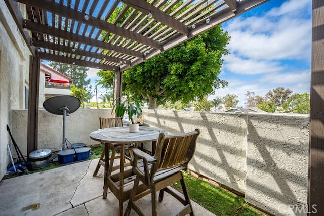 23391 La Crescenta Unit 270C, Mission Viejo, CA 92691 - view of patio with outdoor dining area and a pergola