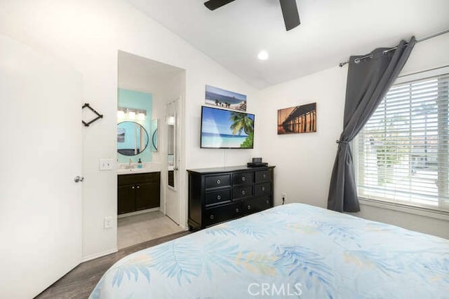 23391 La Crescenta Unit 270C, Mission Viejo, CA 92691 - bedroom with multiple windows, lofted ceiling, wood finished floors, a ceiling fan, and connected bathroom