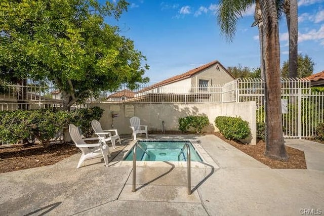 23391 La Crescenta Unit 270C, Mission Viejo, CA 92691 - view of pool with a fenced backyard and a patio area