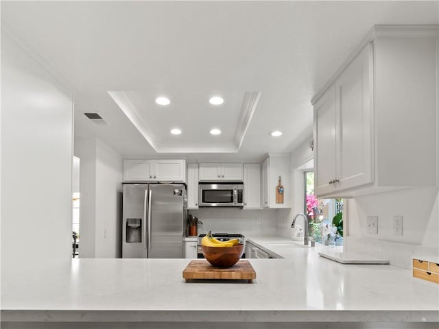 24822 Cutter, Laguna Niguel, CA 92677 - kitchen with appliances with stainless steel finishes, a sink, recessed lighting, a peninsula, and white cabinetry