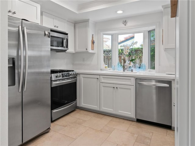 24822 Cutter, Laguna Niguel, CA 92677 - kitchen featuring stainless steel appliances, a sink, light countertops, ornamental molding, and recessed lighting