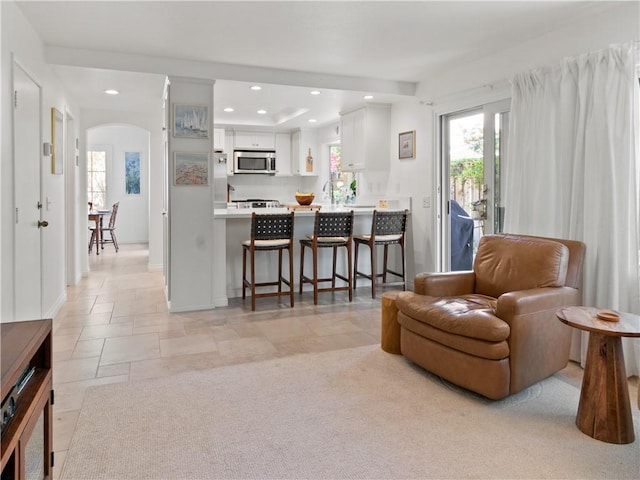 24822 Cutter, Laguna Niguel, CA 92677 - living room featuring arched walkways, recessed lighting, and baseboards