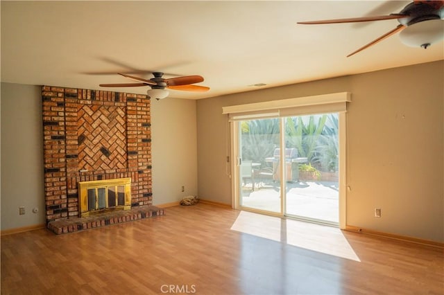 1219 Canyon View Dr, La Verne, CA 91750 - unfurnished living room featuring ceiling fan, wood finished floors, baseboards, and a fireplace