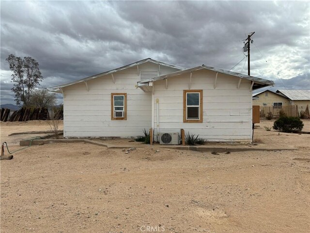 3940 Morongo Rd Unit 29, Palms, CA 92277 - rear view of property with a cooling unit