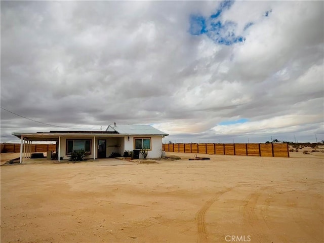 3940 Morongo Rd Unit 29, Palms, CA 92277 - rear view of property with fence