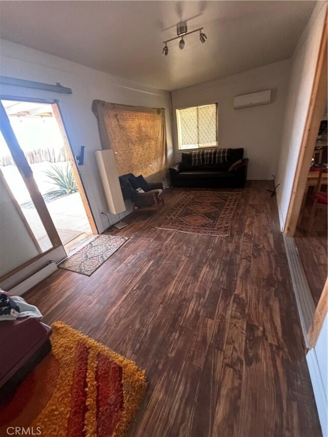 3940 Morongo Rd Unit 29, Palms, CA 92277 - living room with a wall mounted air conditioner and wood finished floors