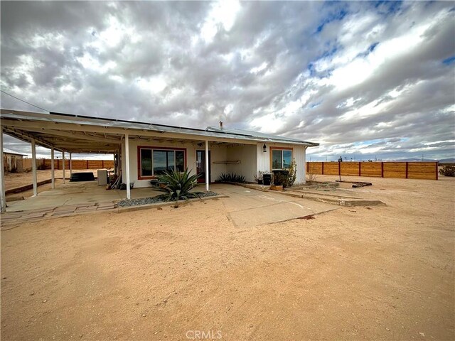 3940 Morongo Rd Unit 29, Palms, CA 92277 - back of house with a patio and fence