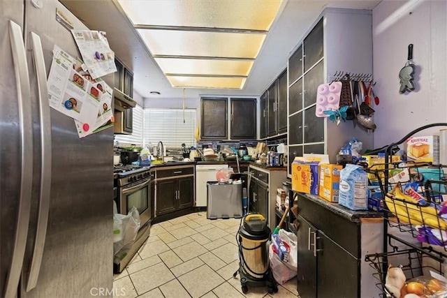 435 Leverett Ave, La Puente, CA 91744 - kitchen with appliances with stainless steel finishes, dark countertops, and light tile patterned flooring