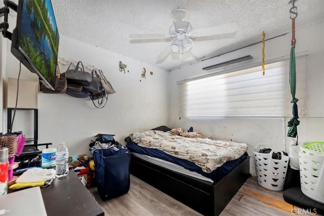 435 Leverett Ave, La Puente, CA 91744 - bedroom with wood finished floors, a textured ceiling, and ceiling fan