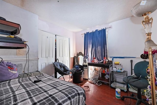 435 Leverett Ave, La Puente, CA 91744 - bedroom with wood finished floors, a textured ceiling, and a closet