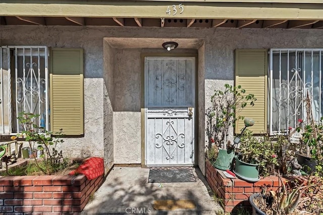 435 Leverett Ave, La Puente, CA 91744 - doorway to property featuring stucco siding