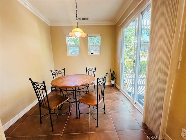 40973 Cebu Dr, Temecula, CA 92591 - dining area with crown molding, dark tile patterned flooring, and baseboards