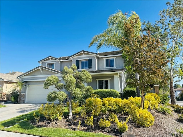 40973 Cebu Dr, Temecula, CA 92591 - craftsman house with concrete driveway, stucco siding, and an attached garage