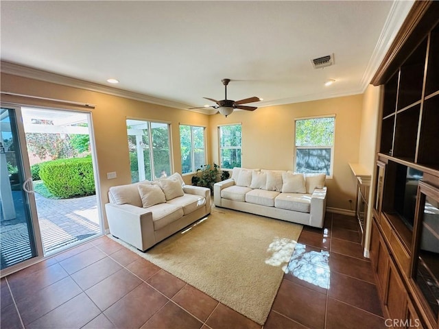 40973 Cebu Dr, Temecula, CA 92591 - living area with dark tile patterned floors, ornamental molding, ceiling fan, recessed lighting, and baseboards