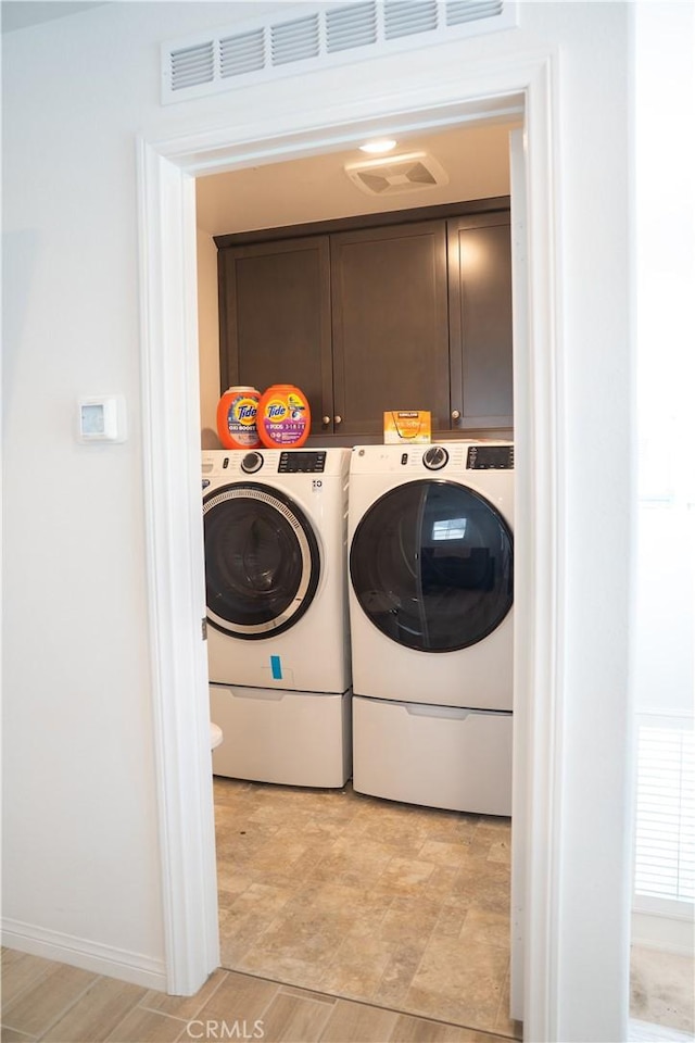 15148 Ridge Ln Unit 4, Fontana, CA 92336 - laundry room featuring cabinet space, washing machine and clothes dryer, and baseboards