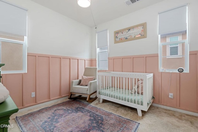 345 Allen Dr, Santa Paula, CA 93060 - bedroom featuring a decorative wall, a wainscoted wall, a nursery area, and carpet flooring