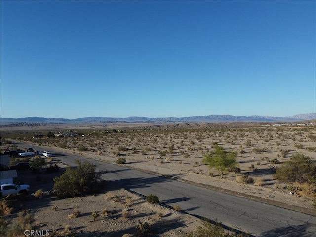 7677 Bedouin Ave Unit 29, Palms, CA 92277 - view of mountain backdrop featuring a desert landscape