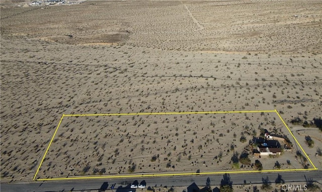 7677 Bedouin Ave Unit 29, Palms, CA 92277 - aerial overview of property's location featuring property parcel outlined and a desert landscape
