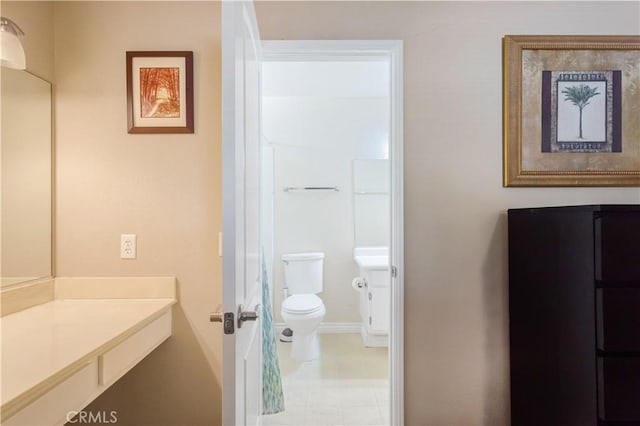 28001 Winged Foot Dr, Menifee, CA 92586 - bathroom with toilet, vanity, and baseboards